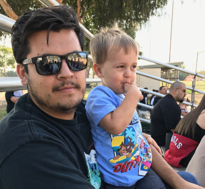 at a baseball game with my second kid
