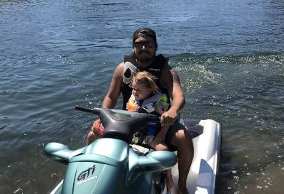 on a jet ski with my third kid